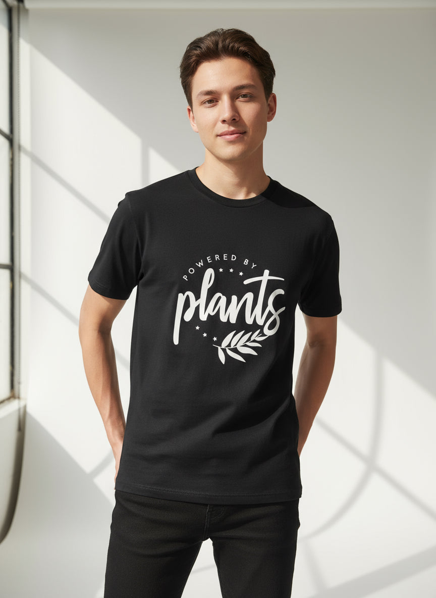 Person wearing a black t-shirt with 'Powered by plants' text vegan