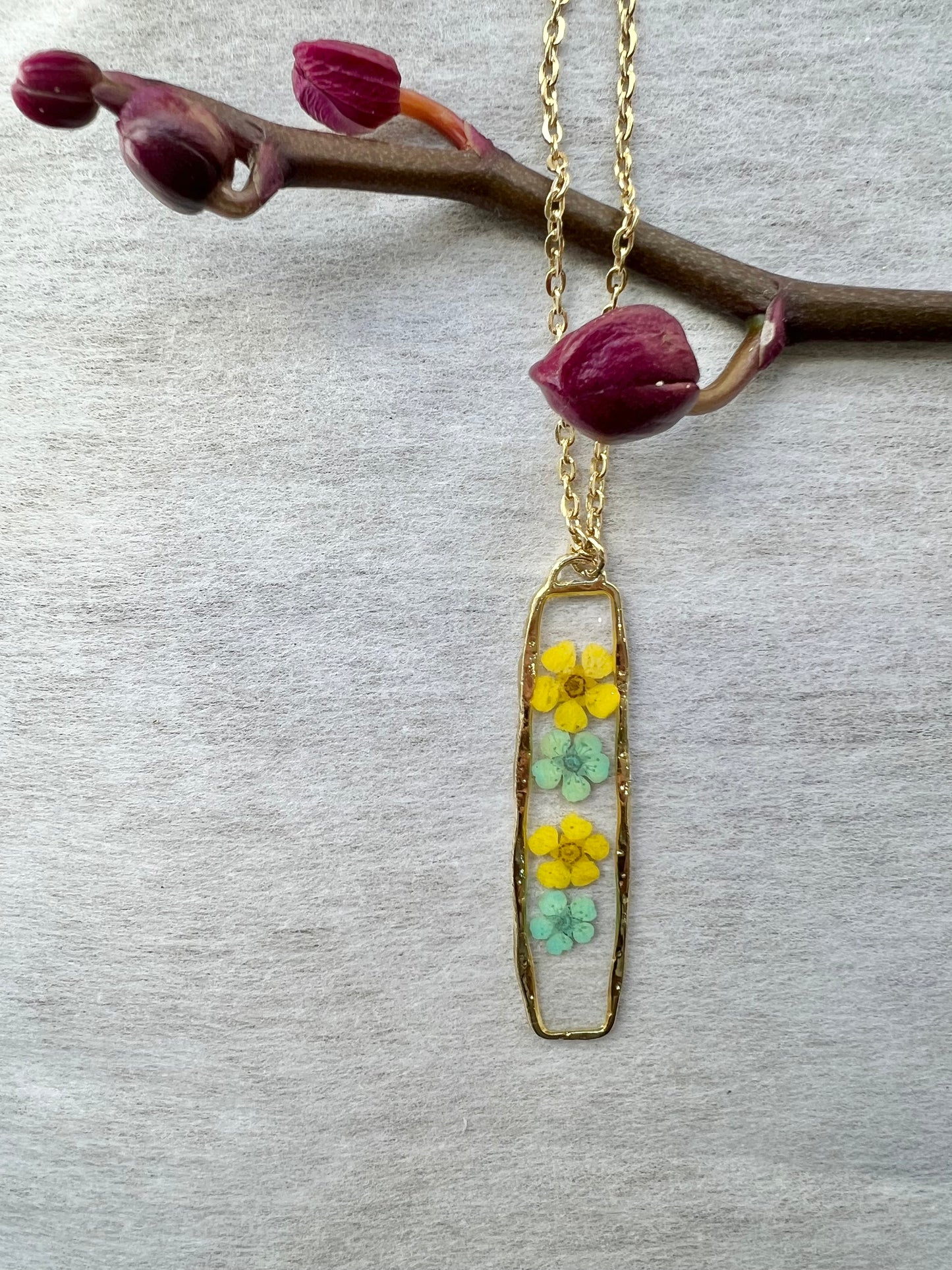four tiny blue green and yellow flowers necklace