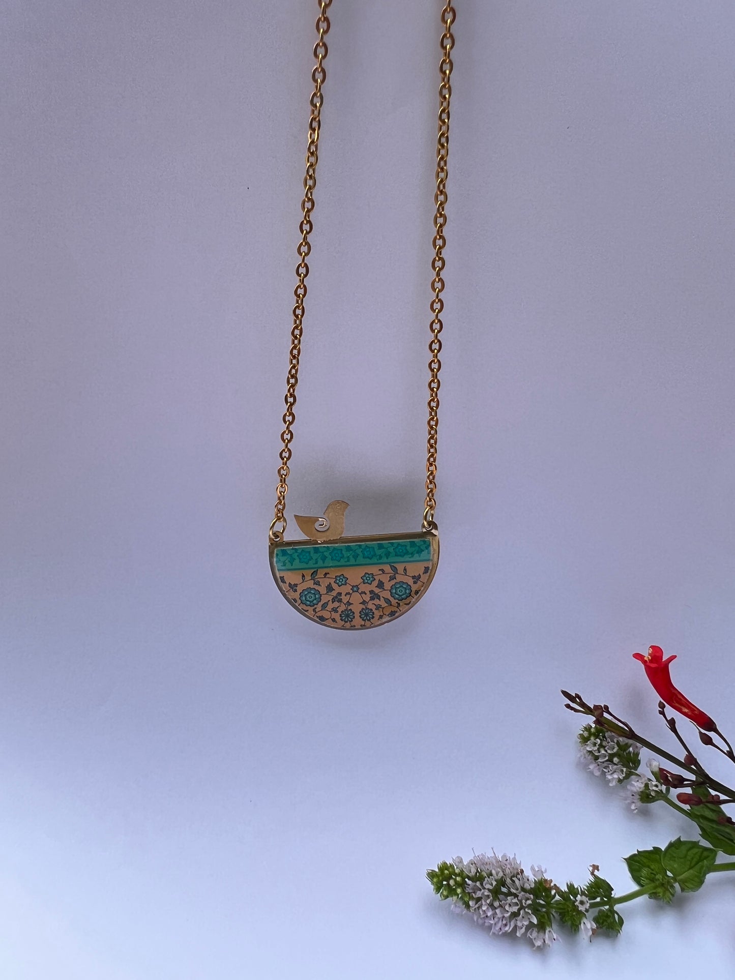 Turquoise and golden orange half circle necklace with bird